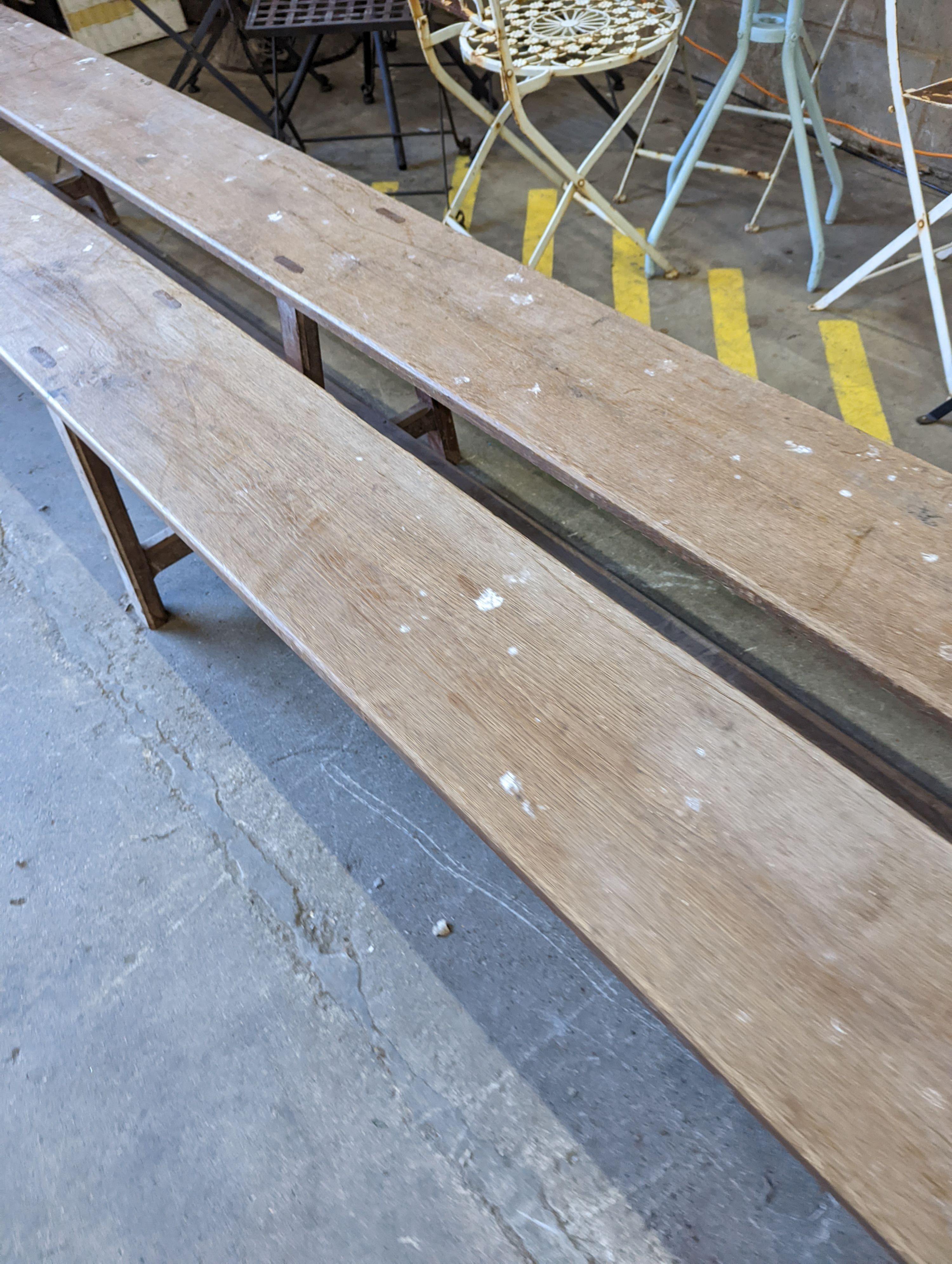 A pair of 19th century French provincial oak long bench seats, length 300cm, depth 24cm, height 45cm